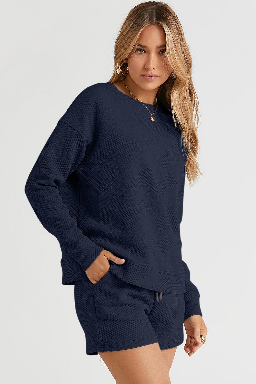 Long-sleeve top with a round neck and cozy dropped shoulders, paired with drawstring shorts.