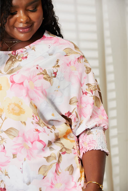 Floral Top features a classic round neck and three-quarter sleeves