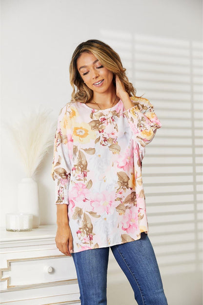 Floral Top features a classic round neck and three-quarter sleeves