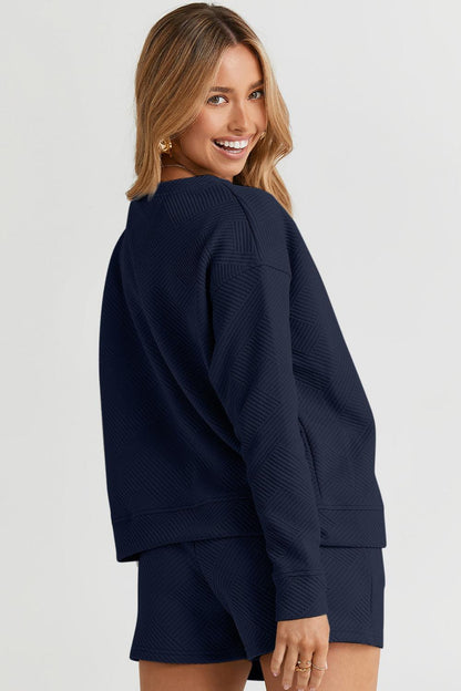 Long-sleeve top with a round neck and cozy dropped shoulders, paired with drawstring shorts.