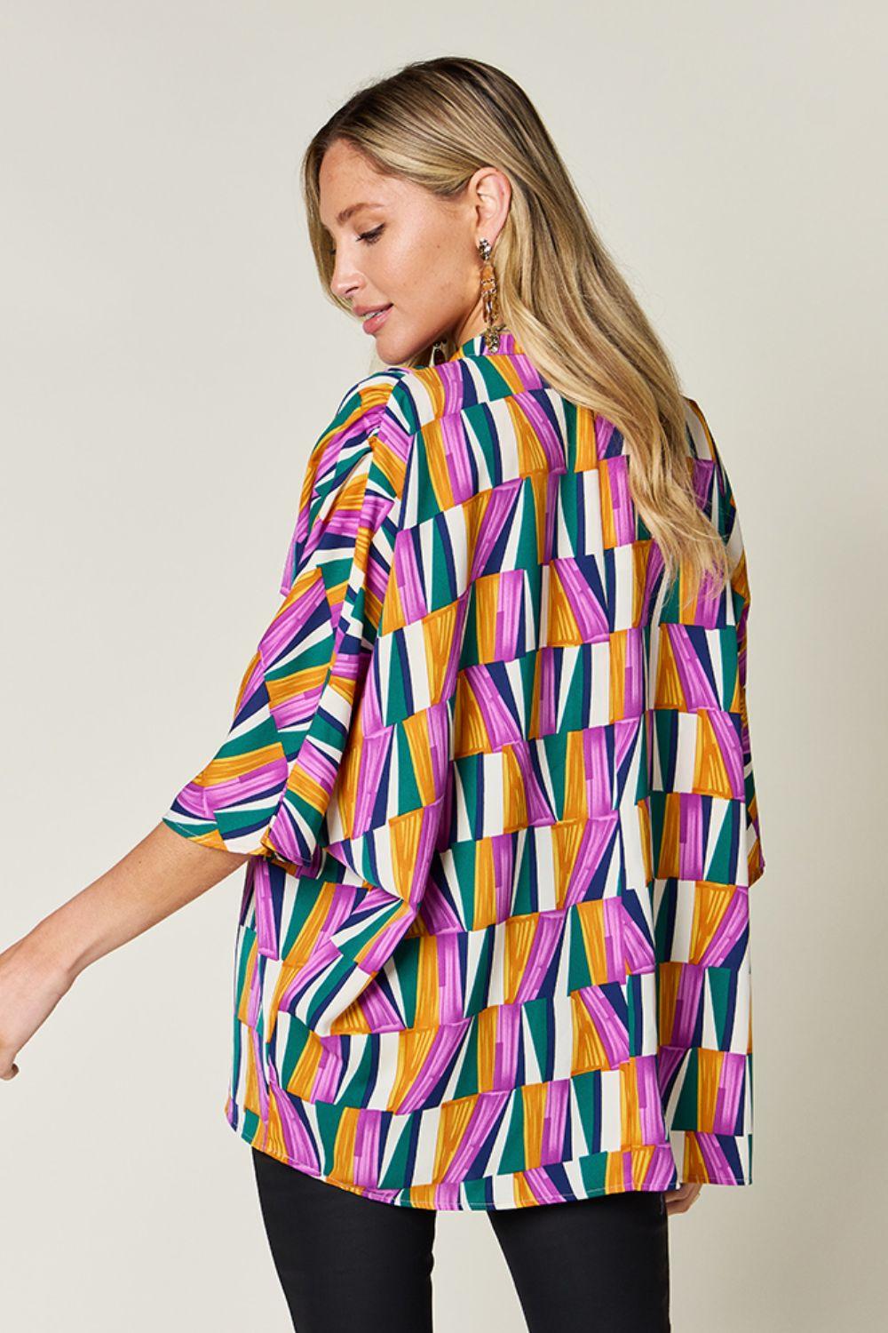 Geometric Notched Dolman Sleeve Top