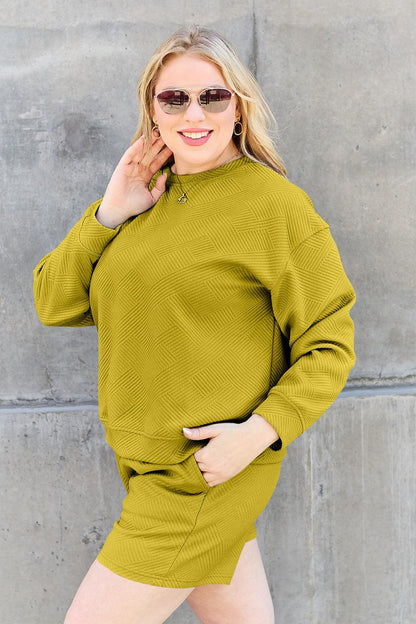 Long-sleeve top with a round neck and cozy dropped shoulders, paired with drawstring shorts.