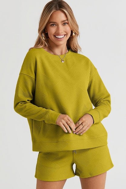 Long-sleeve top with a round neck and cozy dropped shoulders, paired with drawstring shorts.