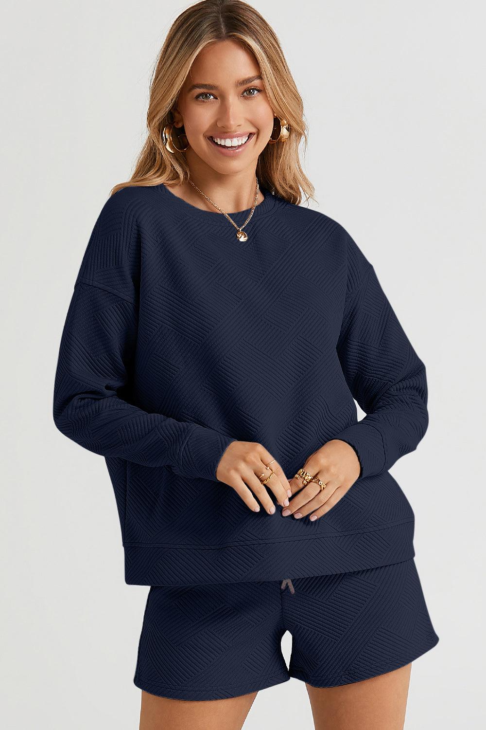 Long-sleeve top with a round neck and cozy dropped shoulders, paired with drawstring shorts.