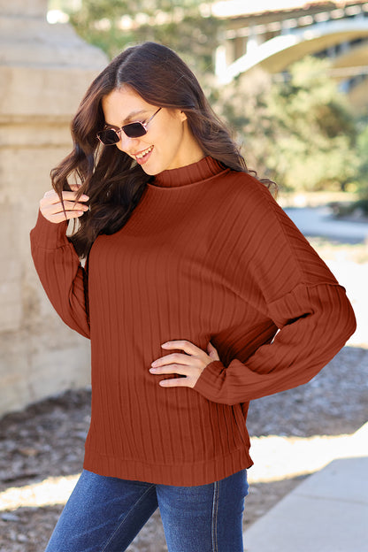 Ribbed knit top has a Mock Neck