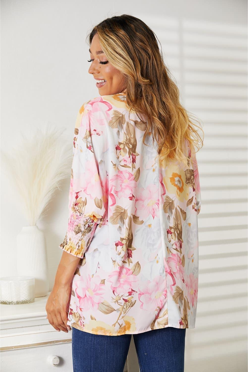 Floral Top features a classic round neck and three-quarter sleeves