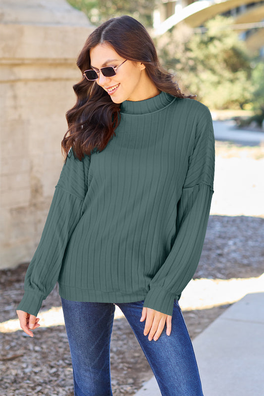 Ribbed knit top has a Mock Neck