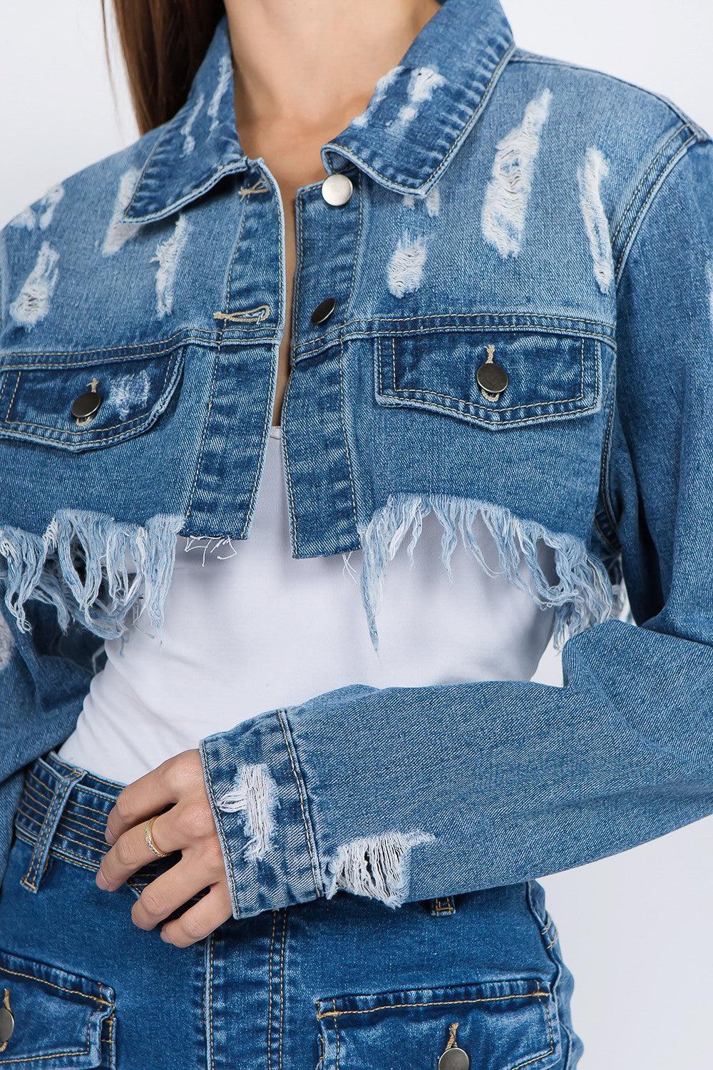 Distressed denim jacket with a frayed hem