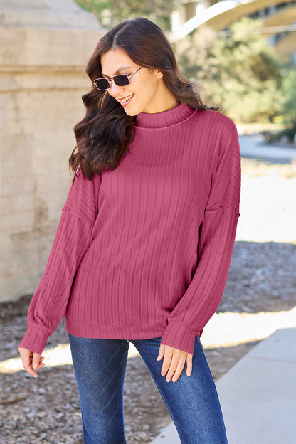 Ribbed knit top has a Mock Neck