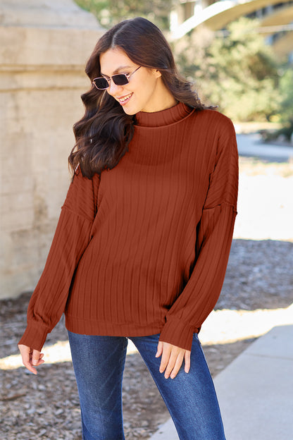 Ribbed knit top has a Mock Neck