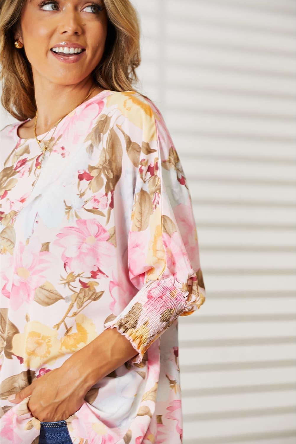 Floral Top features a classic round neck and three-quarter sleeves