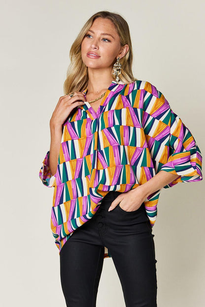 Geometric Notched Dolman Sleeve Top