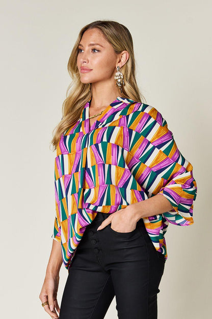 Geometric Notched Dolman Sleeve Top