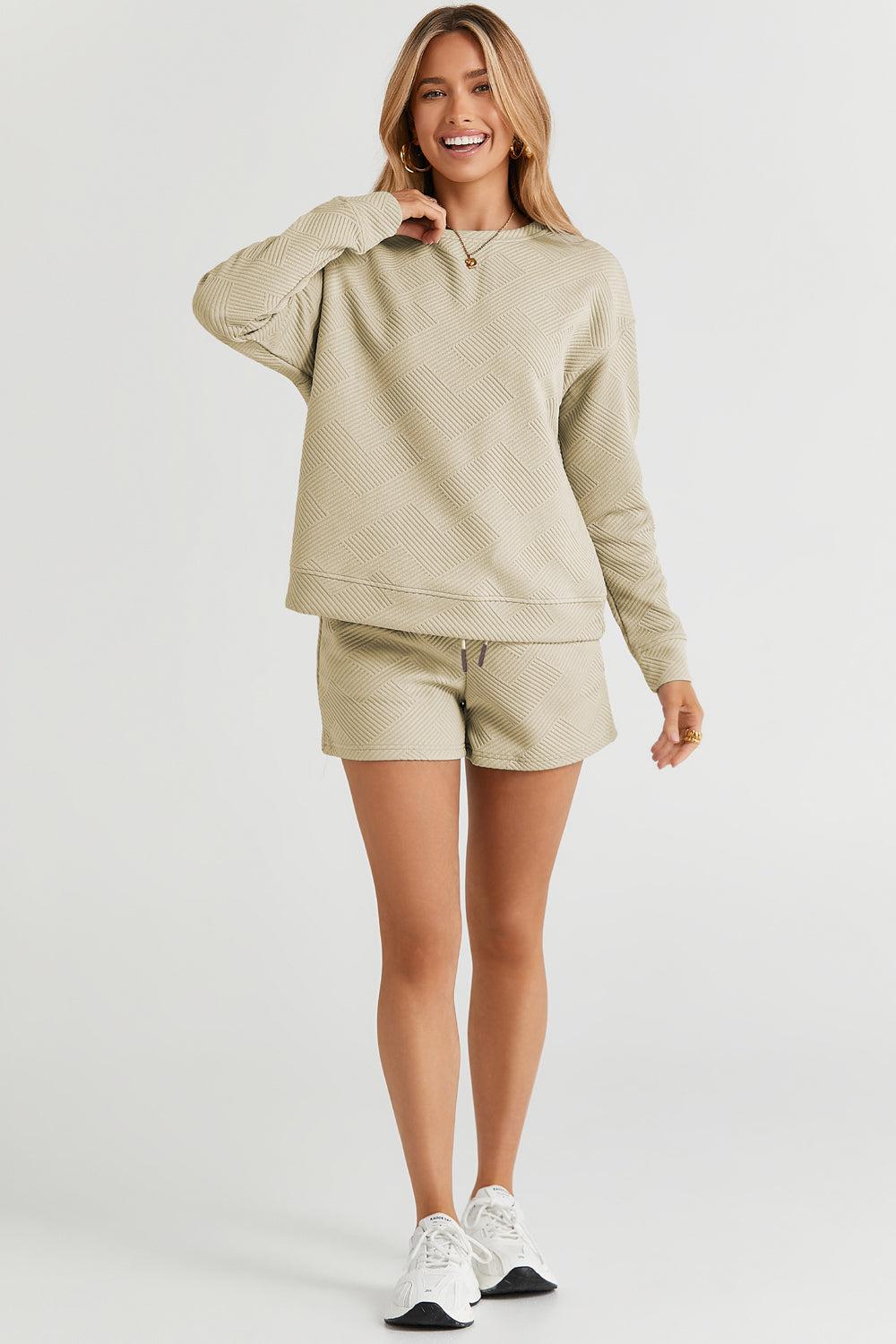 Long-sleeve top with a round neck and cozy dropped shoulders, paired with drawstring shorts.