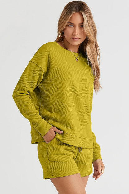 Long-sleeve top with a round neck and cozy dropped shoulders, paired with drawstring shorts.