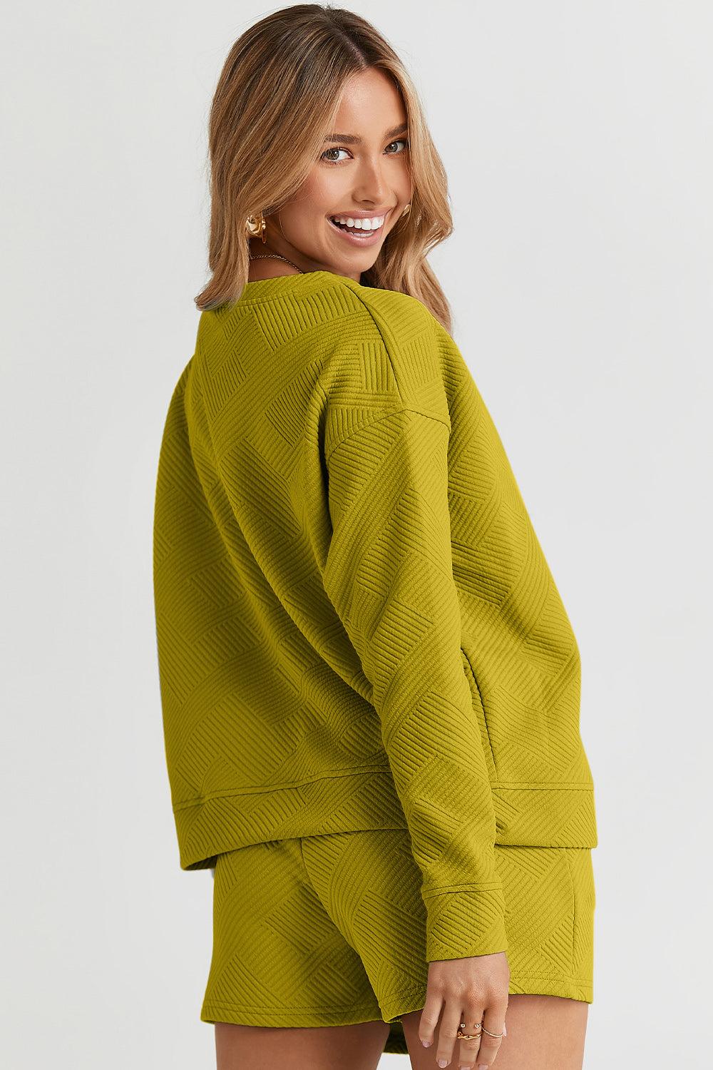 Long-sleeve top with a round neck and cozy dropped shoulders, paired with drawstring shorts.